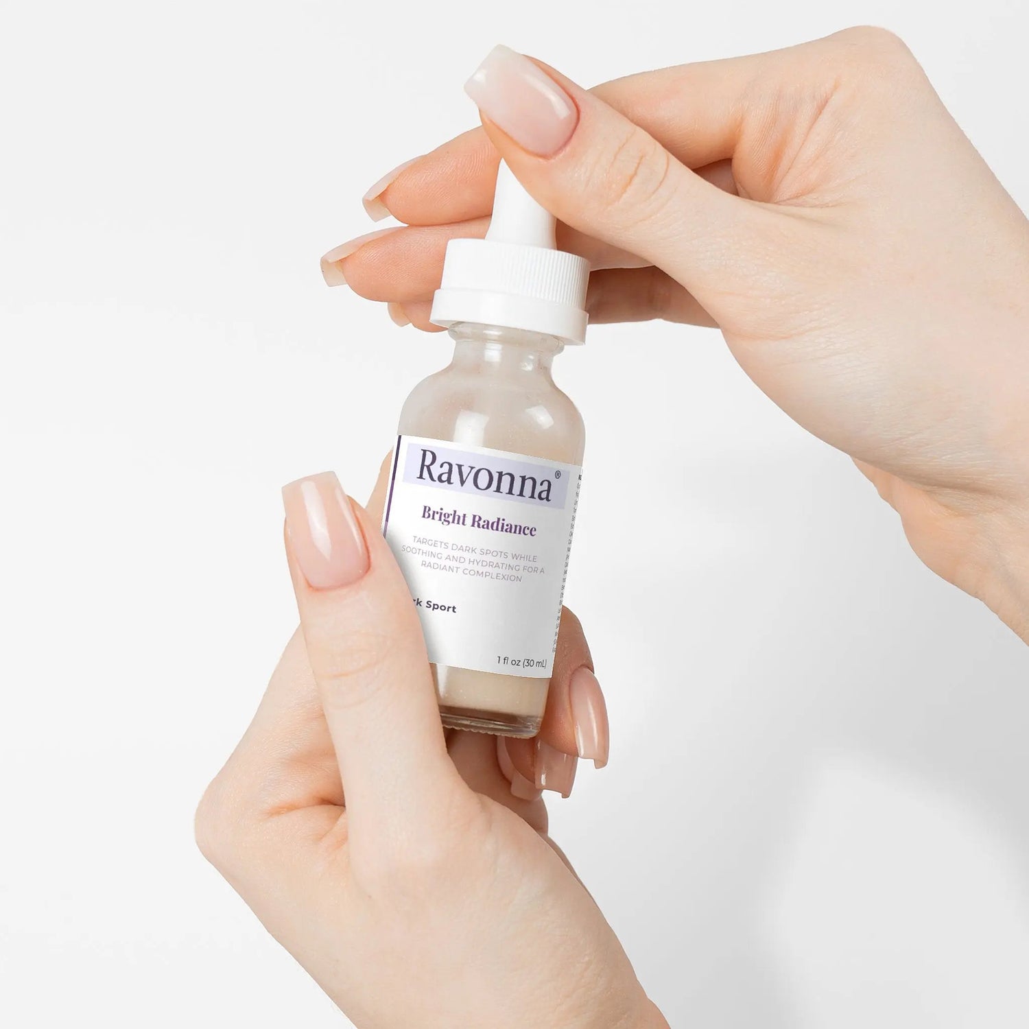 Applying Bright Radiance Serum with dropper – Ravonna