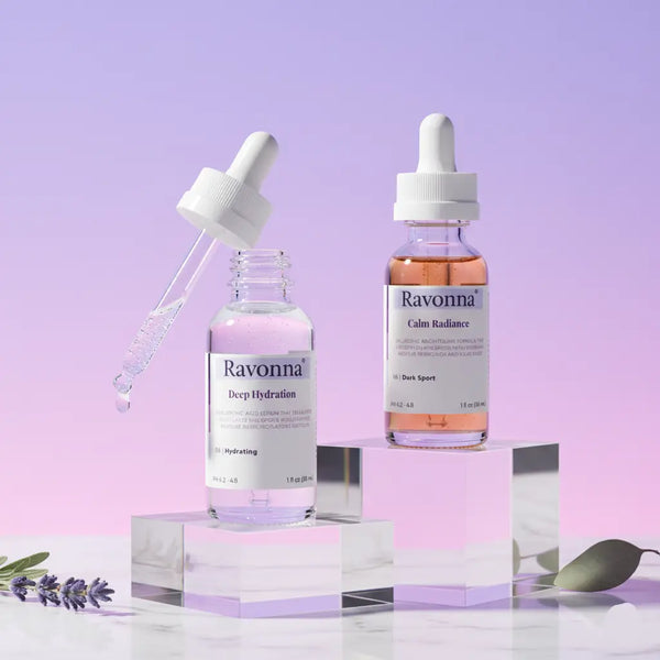 Two Ravonna skincare dropper bottles on a light purple background